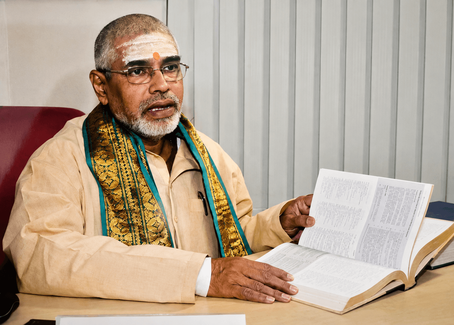 Scholar holding an open book